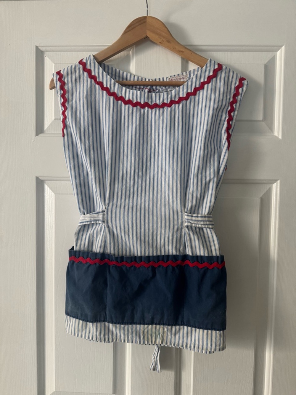 Vintage Blue and white striped apron with red rickrack and blue front pocket.